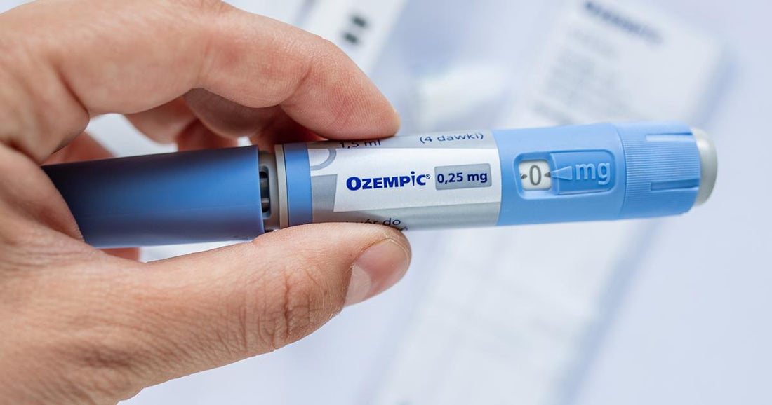 ozempic pen held in a hand